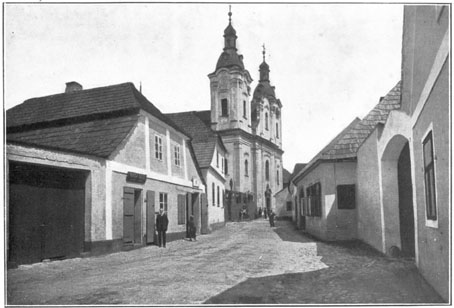 Proměny i kontinuita města ... Kostelní (dnes Plzeňská) ulice L.P. 1909